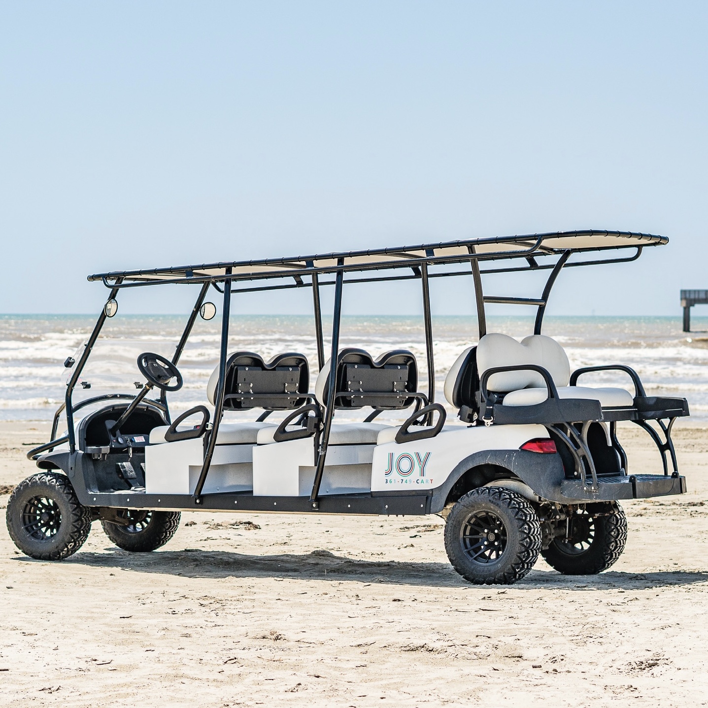 Eight passenger Club Car stretch golf cart on Port Aransas beach